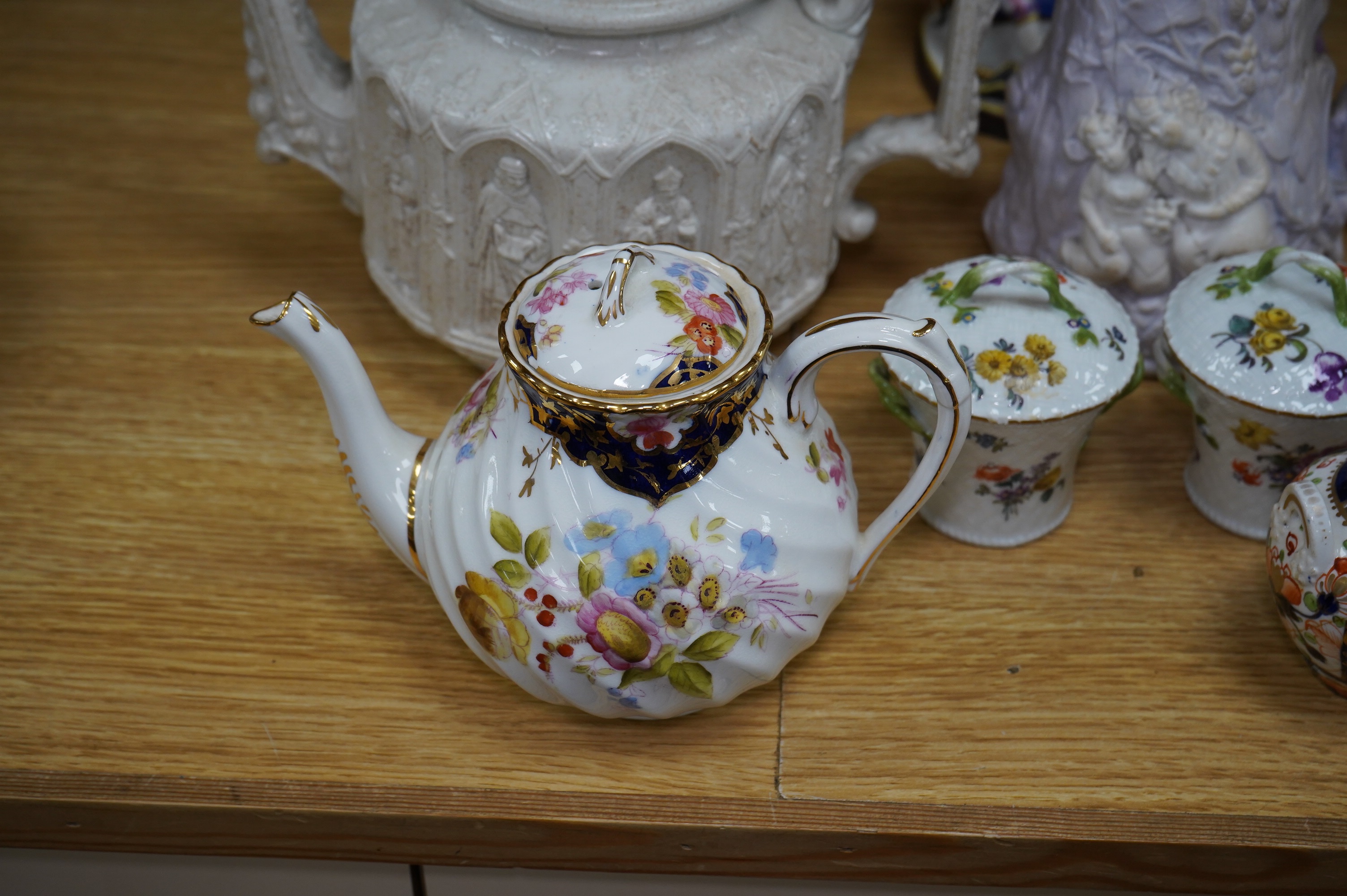 A quantity of 19th and early 20th century ceramics including two chess playing groups, four further Continental figures, a copy of a Meigh teapot, three cups and saucers, two Meissen pots and covers, etc. Condition - var